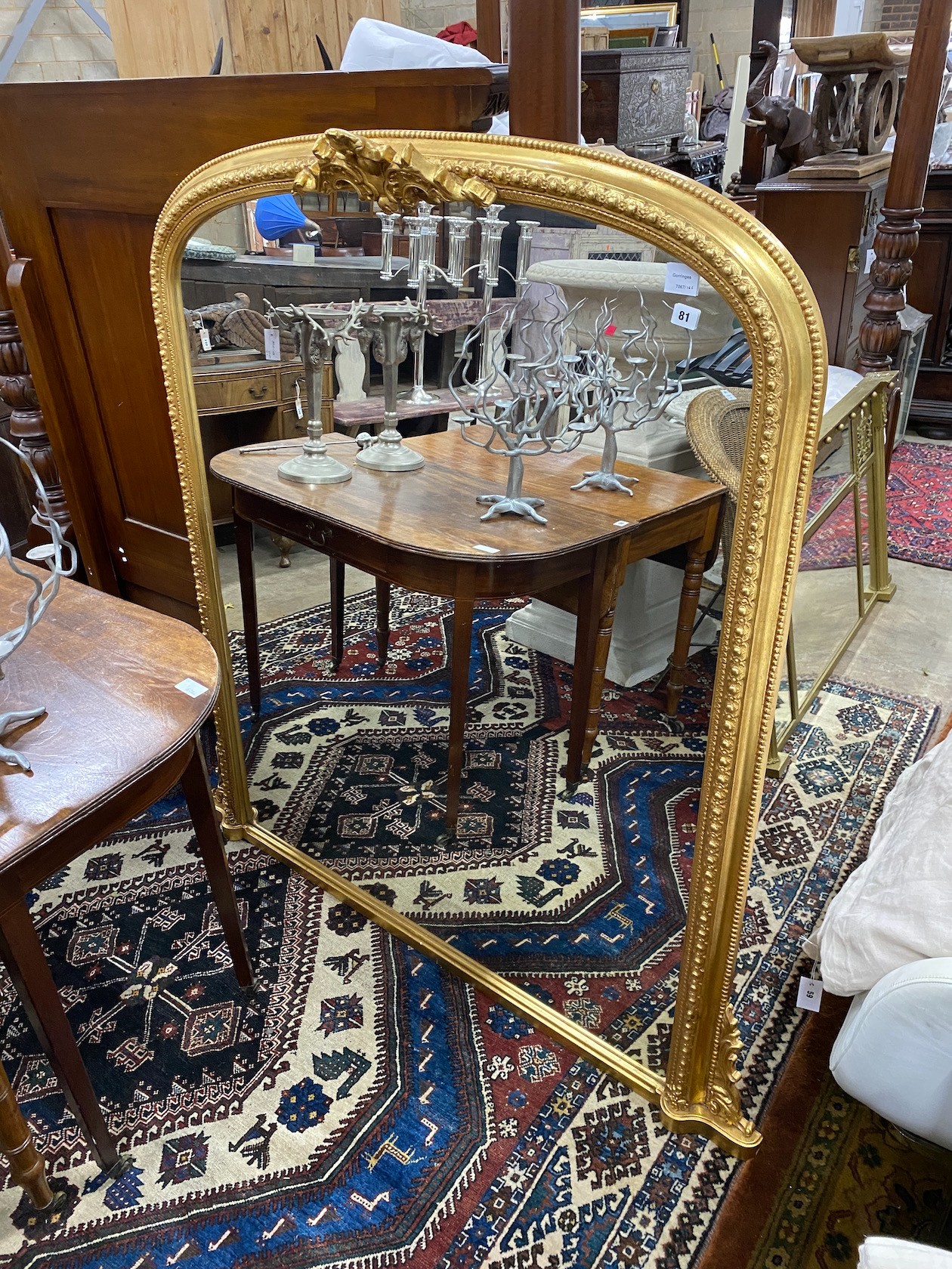 A Victorian style gilt framed overmantel mirror, width 140cm, height 145cm